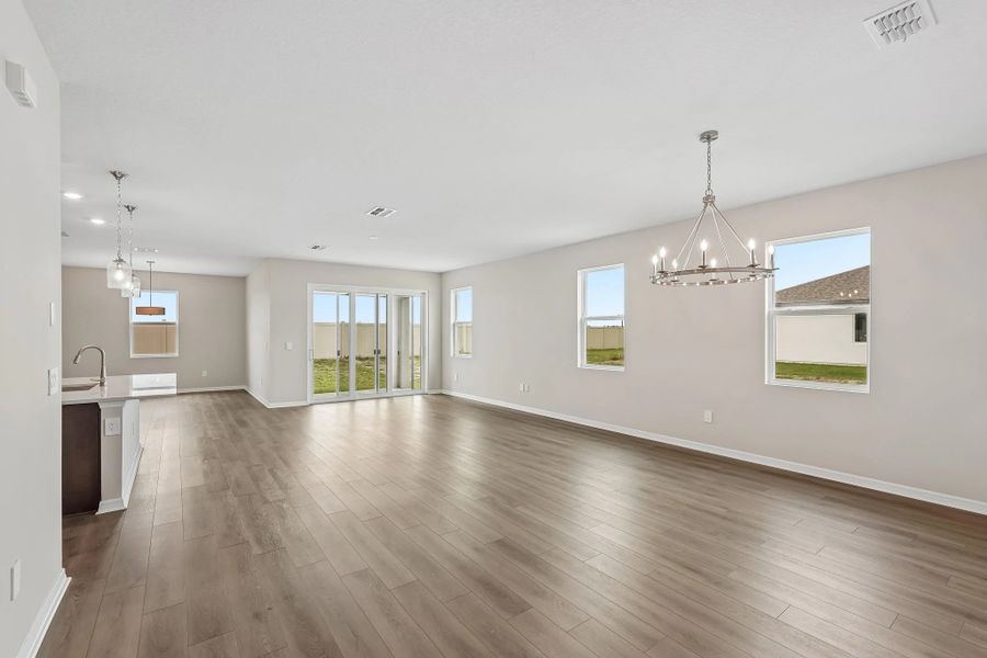 The foyer opens up into the spacious dining, living and kitchen spaces