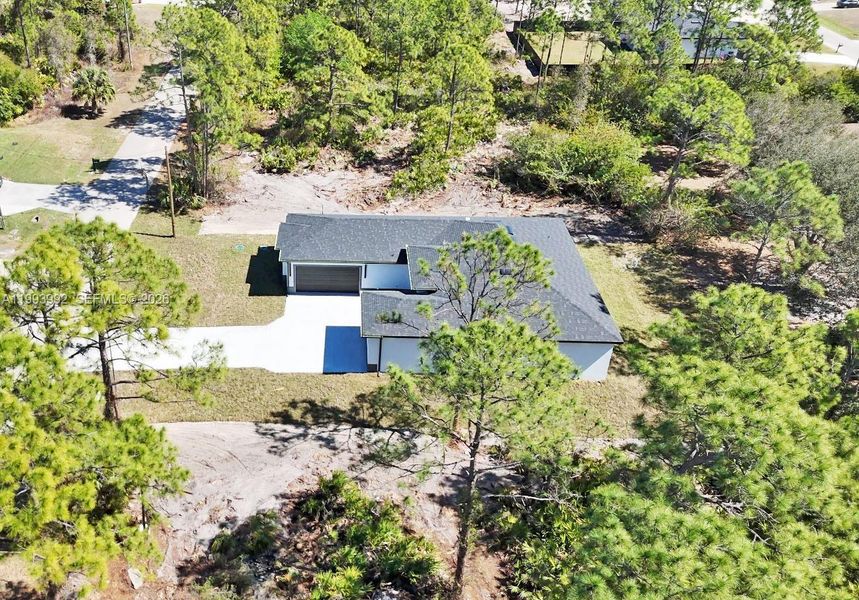 Front exterior of a new home in , Lehigh Acres, FL, highlighting curb appeal (Image 26).