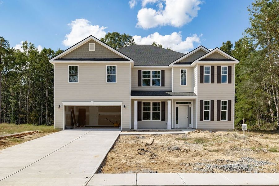 Front exterior of a new home in Ramsey Landing, Rincon, GA, highlighting curb appeal (Image 1).