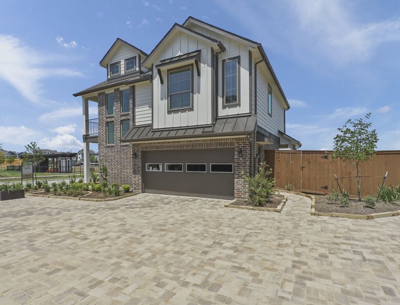 Representative exterior photo of a completed home built from the Riverdale by Chesmar Homes in Sienna Courtyard, Missouri City, TX (Image 9).
