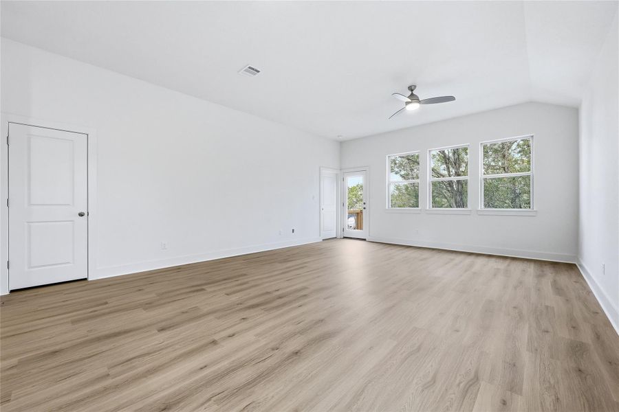 Spare room featuring light wood finished floors and ceiling fan