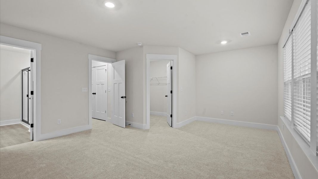 Memorable mornings begin in this tasteful and thoughtfully crafted primary suite