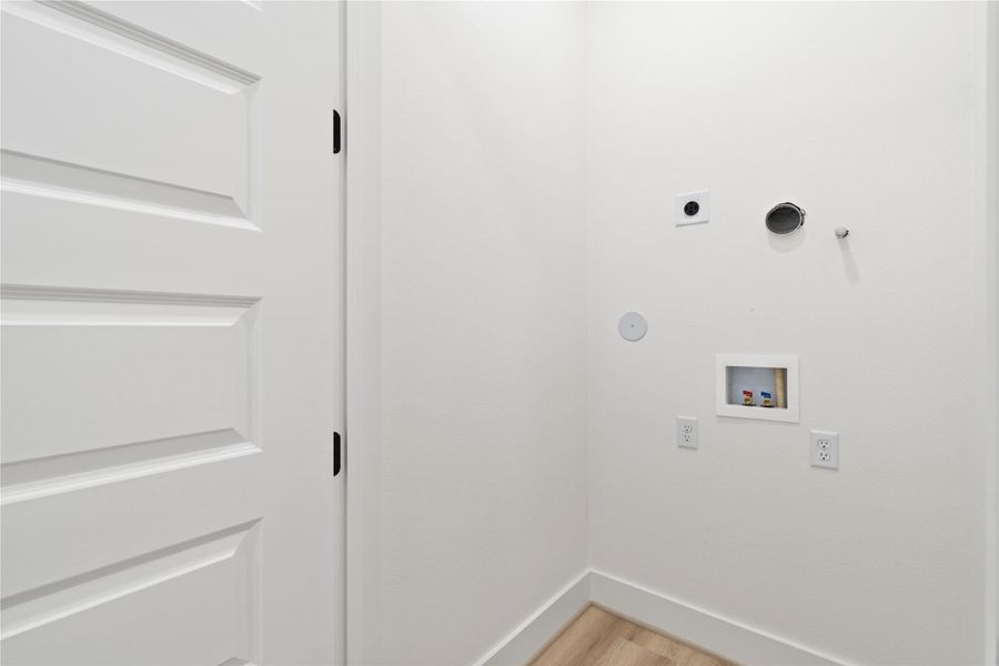 Located on the second floor a dedicated laundry space accommodates a stackable washer and dryer, maximizing efficiency without compromising on design.