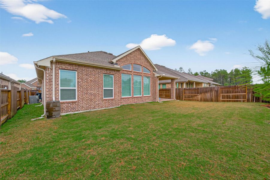 Exterior details and patio area of a home in Artavia, Conroe (Image 27).