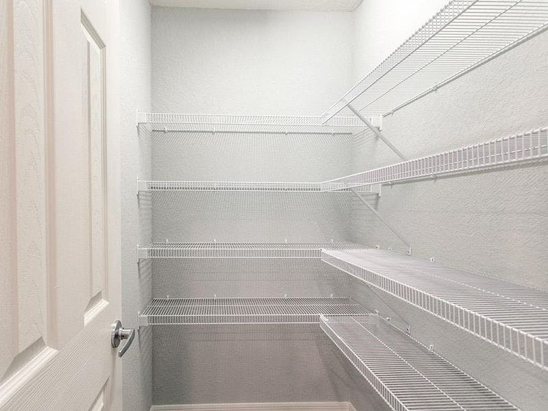 A walk-in pantry provides storage convenience - Parsyn by Highland Homes
