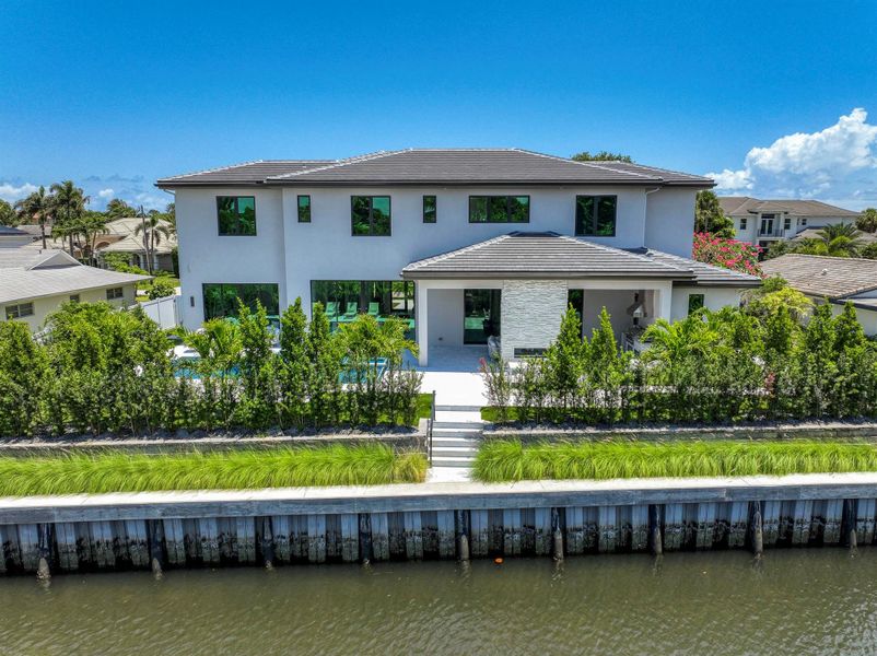 Front exterior of a new home in , Palm Beach Gardens, FL, highlighting curb appeal (Image 18). Front exterior of a new home in , Palm Beach Gardens, FL, highlighting curb appeal (Image 18).