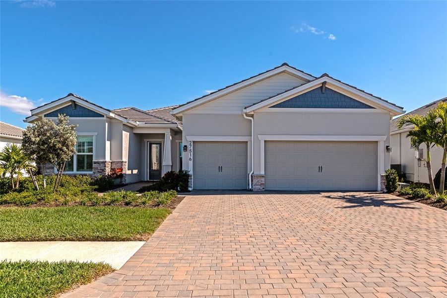 Front exterior of a new home in , Englewood, FL, highlighting curb appeal (Image 23). Front exterior of a new home in , Englewood, FL, highlighting curb appeal (Image 23).