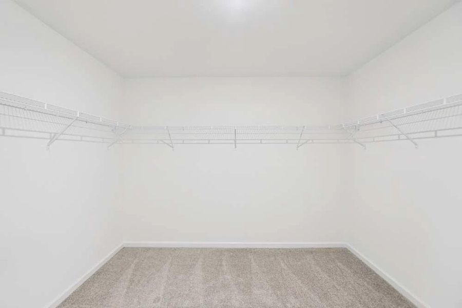 Sample Photo: Primary Bedroom Walk-In Closet Sample Photo: Primary Bedroom Walk-In Closet
