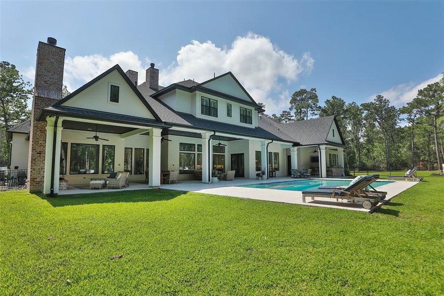 A view of the back of this sprawling house and a look at just how big the outdoor living space really is! The house is equipped with a Generator, so loosing power is not an option.