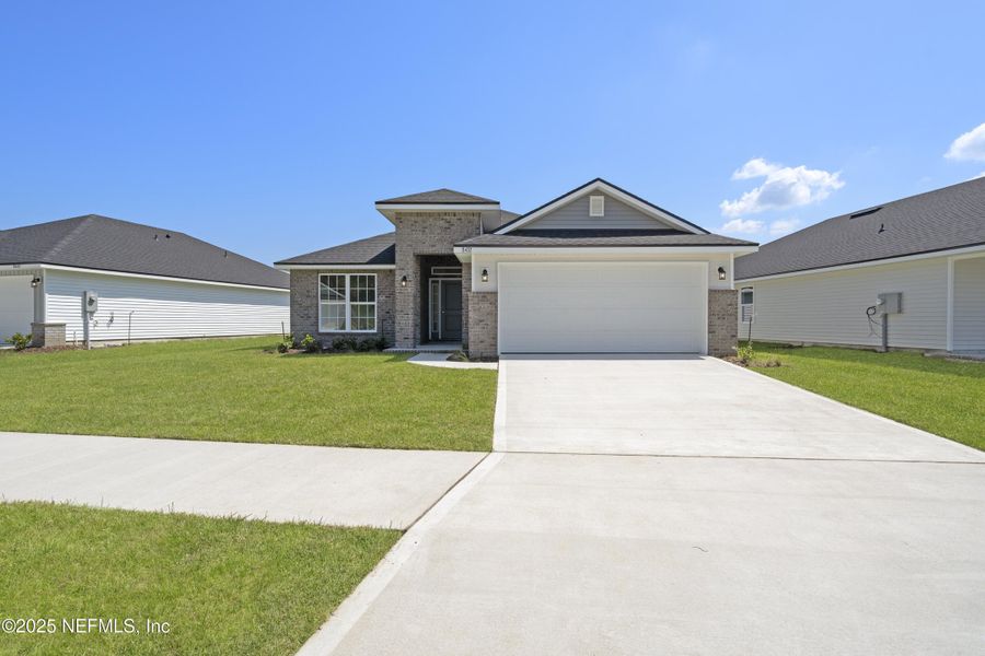 Front exterior of a new home in Summerglen, Jacksonville, FL, highlighting curb appeal (Image 26).