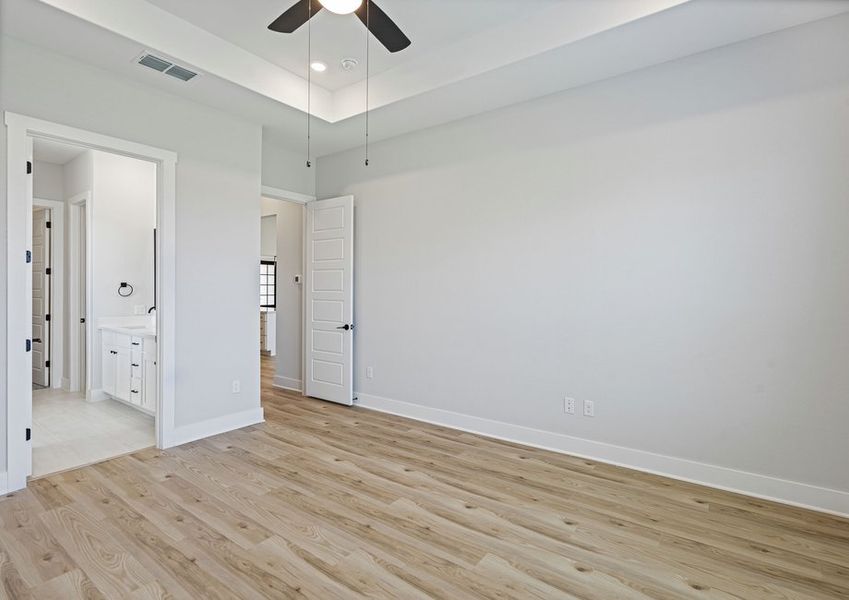 The master bedroom is spacious and an fit king-sized furniture.