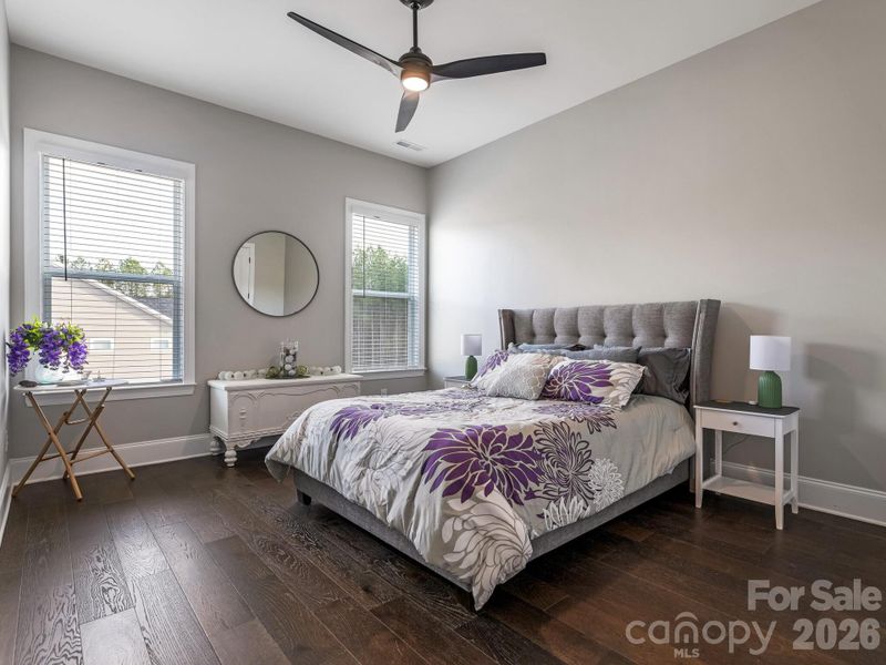 1st Flr, Bdrm, ceiling fan, and hardwood floors (14x12)