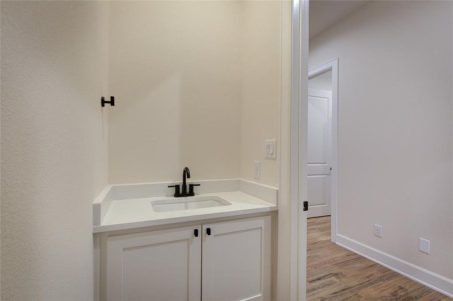 Half-bath is near garage entry and laundry room.