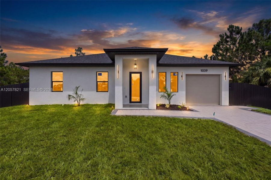 Front exterior of a new home in , Lehigh Acres, FL, highlighting curb appeal (Image 1). Front exterior of a new home in , Lehigh Acres, FL, highlighting curb appeal (Image 1).