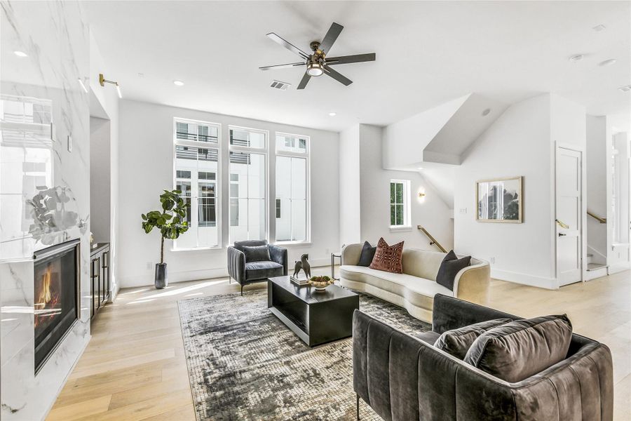 Expansive windows drench the living area in sunlight, creating a bright and rejuvenating atmosphere. The modern neutral palette and designer lighting complement the sleek aesthetic, while premium energy-efficient windows ensure year-round comfort. A tranquil setting ideal for executive relaxation, resident study, or weekend entertaining.