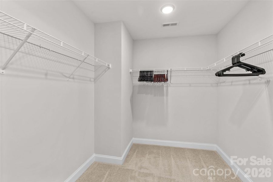 Primary Walk-in Closet Primary Walk-in Closet