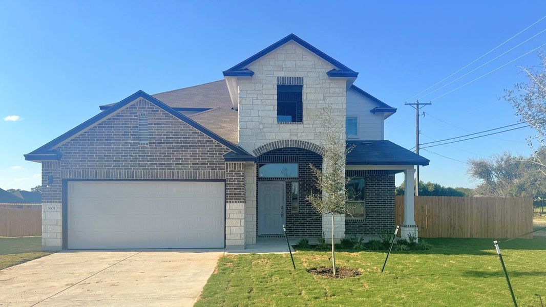 Front exterior of a new home in Foxborough, Waco, TX, highlighting curb appeal (Image 1). Front exterior of a new home in Foxborough, Waco, TX, highlighting curb appeal (Image 1).