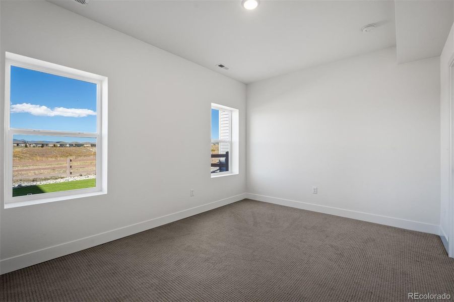 Spacious, unfurnished interior of a new home in Revel Crossing at Wolf Ranch - The Panorama Collection, Colorado Springs (Image 41).