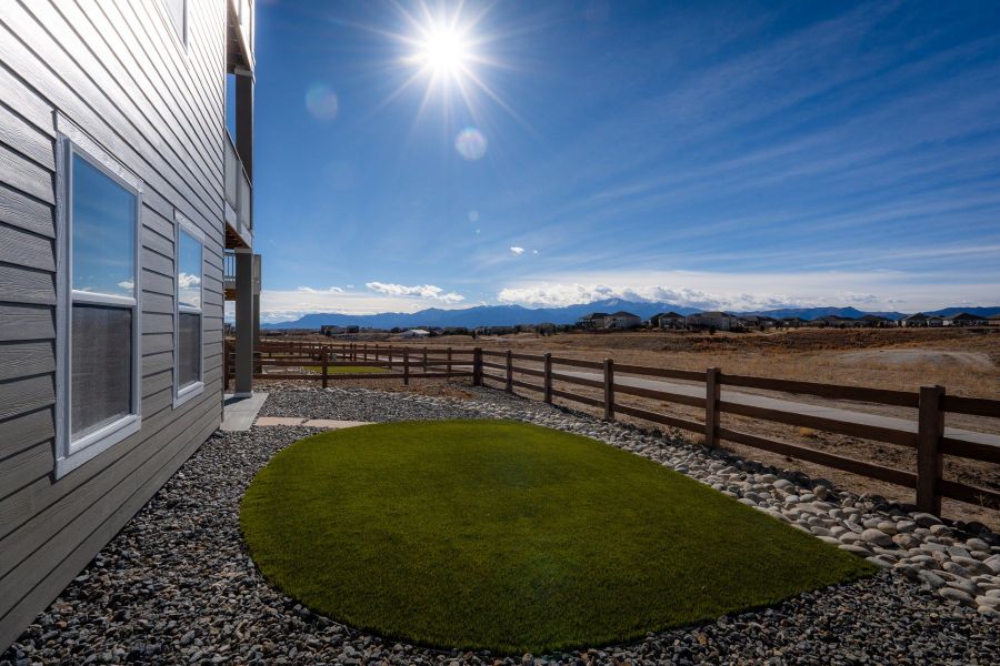 Exterior details and patio area of a home in Revel Crossing at Wolf Ranch - The Panorama Collection, Colorado Springs (Image 3).