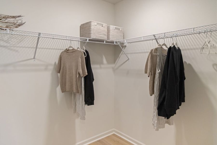Walk-in closet at primary suite Walk-in closet at primary suite
