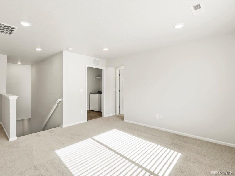 Spacious, unfurnished interior of a new home in Poudre Heights: The Lakes Collection, Windsor (Image 21).