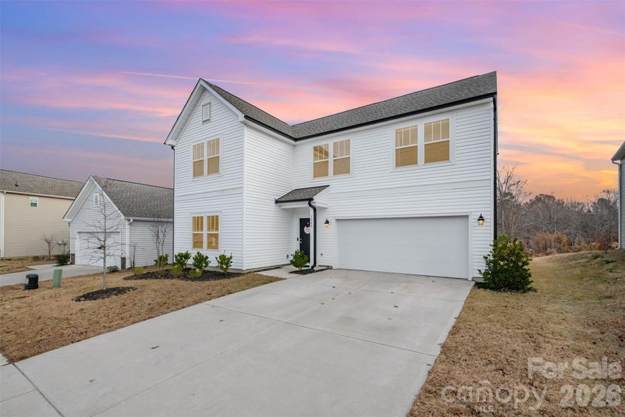Front exterior of a new home in , Mount Holly, NC, highlighting curb appeal (Image 22).