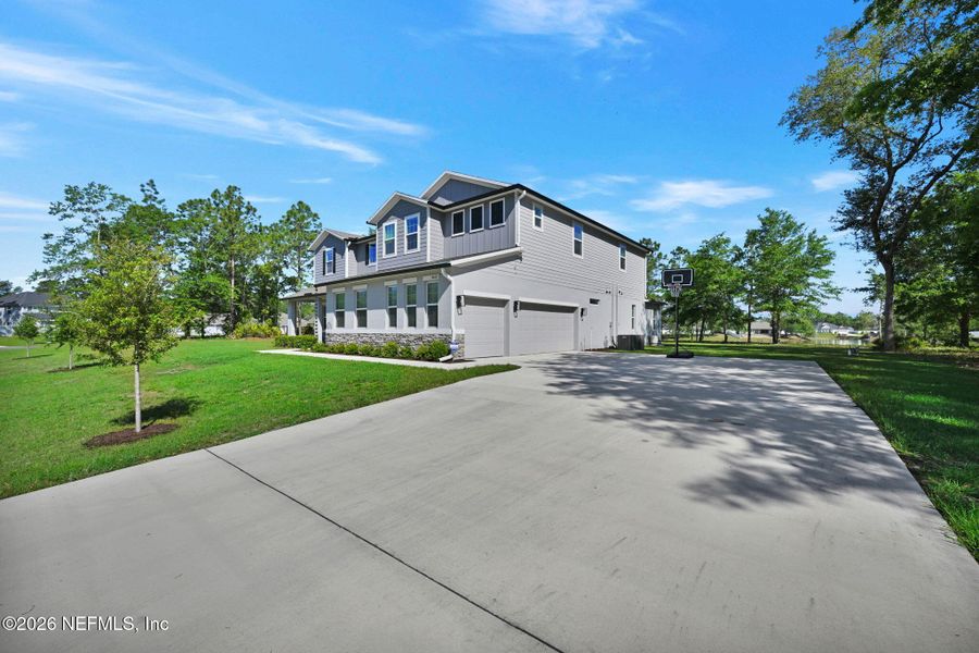 Front exterior of a new home in , Middleburg, FL, highlighting curb appeal (Image 31).
