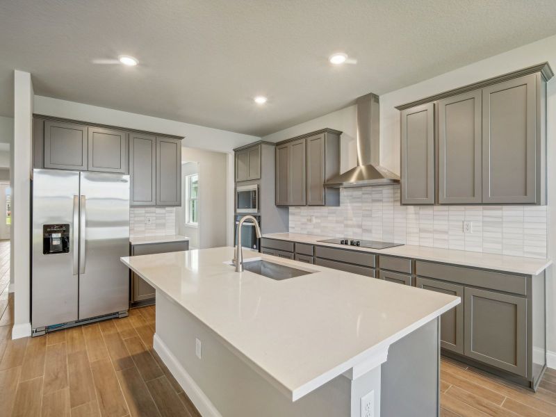 Kitchen in the Onyx floorplan at 6406 NW Sweetwood Drive