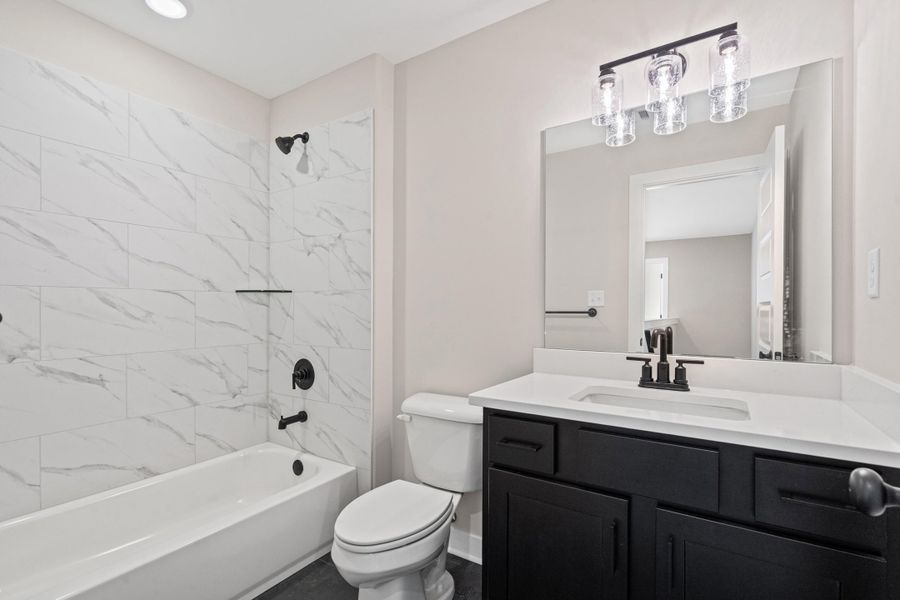 Full bath featuring vanity and shower / bathtub combination