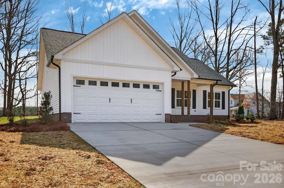 Front exterior of a new home in , Rockwell, NC, highlighting curb appeal (Image 22).