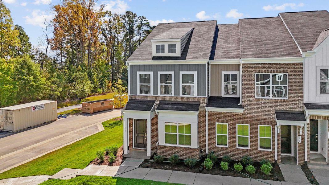 Front exterior of a new home in Renaissance at White Oak, Garner, NC, highlighting curb appeal (Image 16).