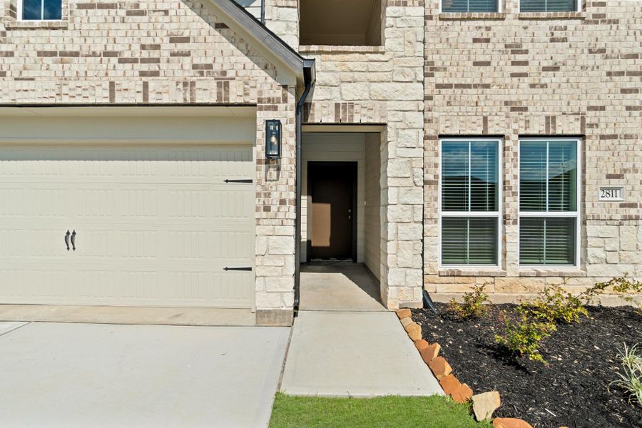 Front exterior of a new home in Morton Creek Ranch, Katy, TX, highlighting curb appeal (Image 18). Front exterior of a new home in Morton Creek Ranch, Katy, TX, highlighting curb appeal (Image 18).