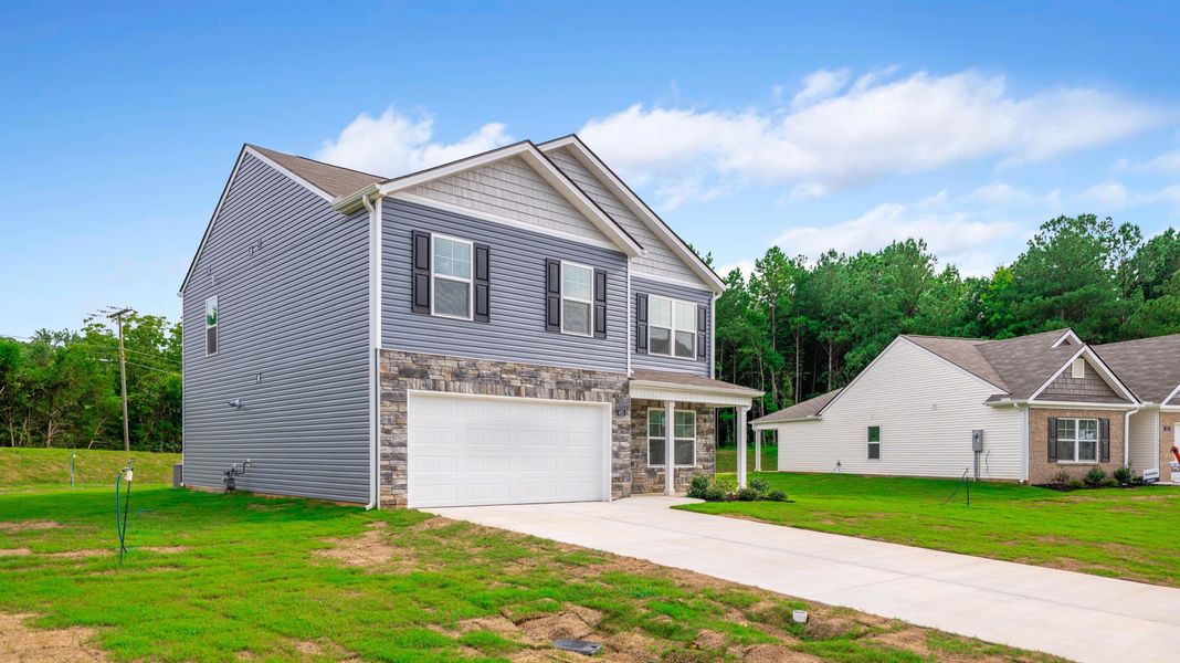 Front exterior of a new home in Byrd Farms, Dayton, TN, highlighting curb appeal (Image 18). Front exterior of a new home in Byrd Farms, Dayton, TN, highlighting curb appeal (Image 18).