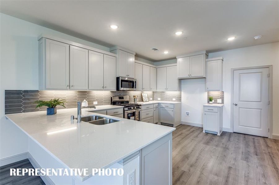 No shortage of space, storage or style in this dream kitchen!  REPRESENTATIVE PHOTO