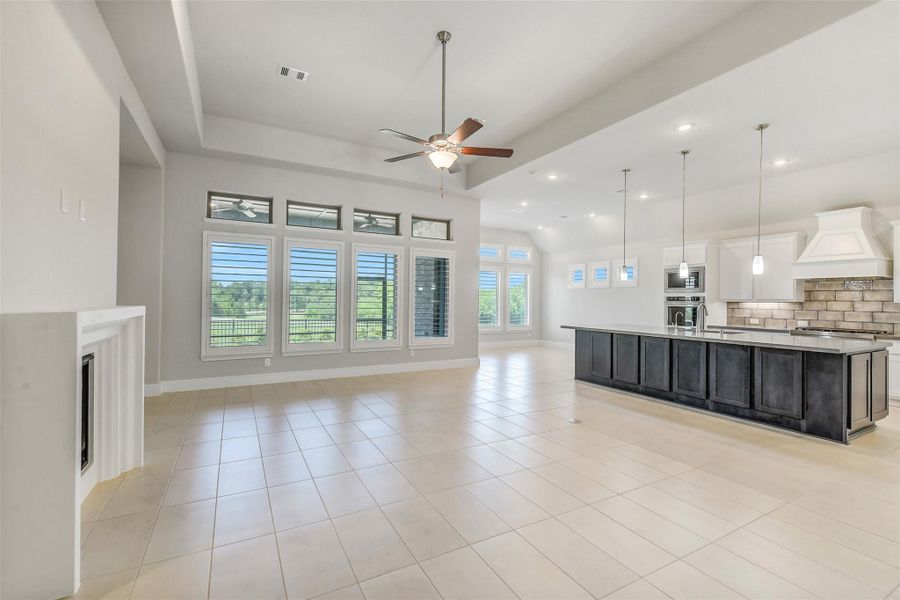 The wonderful view of the golf course behind the home can easily be seen from the oversized window in the family room. The wonderful view of the golf course behind the home can easily be seen from the oversized window in the family room.