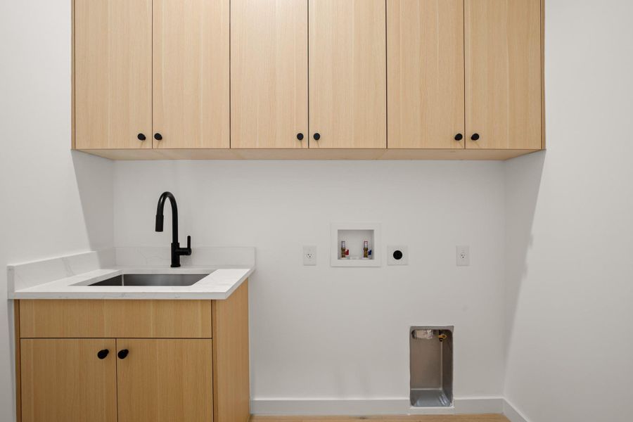 Large laundry room with sink