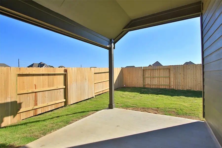 Exterior details and patio area of a home in Oakwood Estates, Waller (Image 3).
