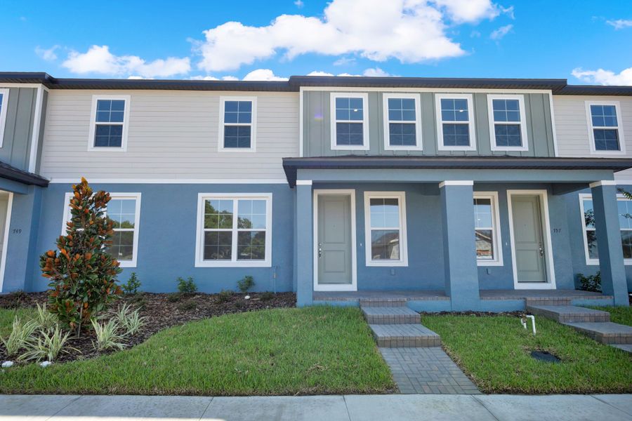 Front exterior of a new home in Eden Crest, Apopka, FL, highlighting curb appeal (Image 15).