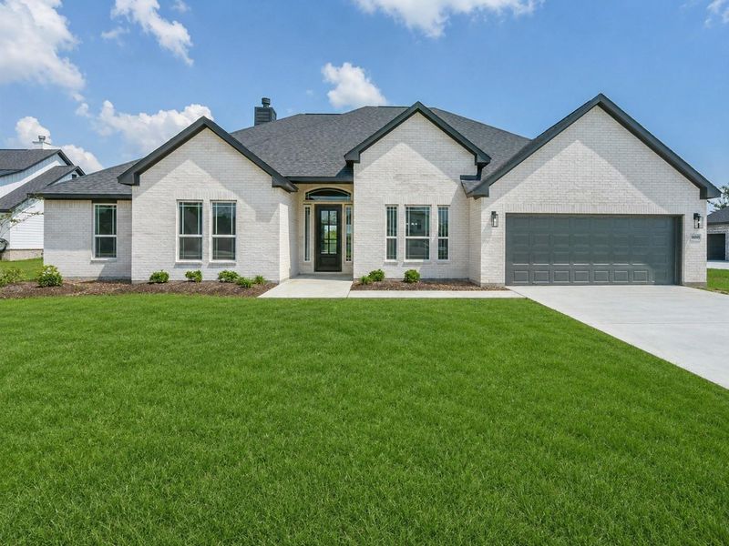 Front exterior of a new home in , Baytown, TX, highlighting curb appeal (Image 27).