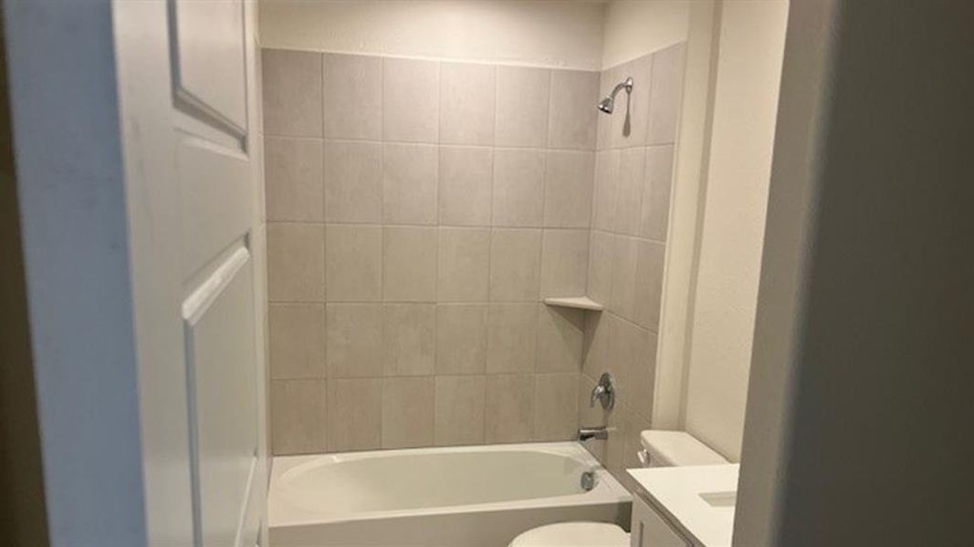 Full bathroom with vanity and shower / bath combination Full bathroom with vanity and shower / bath combination