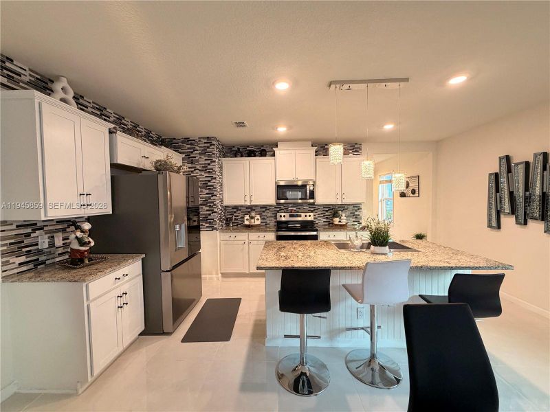 Furnished interior view inside a new home in , Port St. Lucie (Image 15).