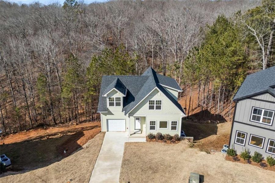 Front exterior of a new home in , Douglasville, GA, highlighting curb appeal (Image 2). Front exterior of a new home in , Douglasville, GA, highlighting curb appeal (Image 2).