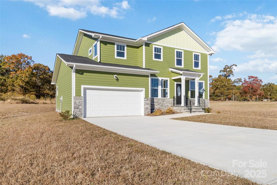 Front exterior of a new home in , Monroe, NC, highlighting curb appeal (Image 2).