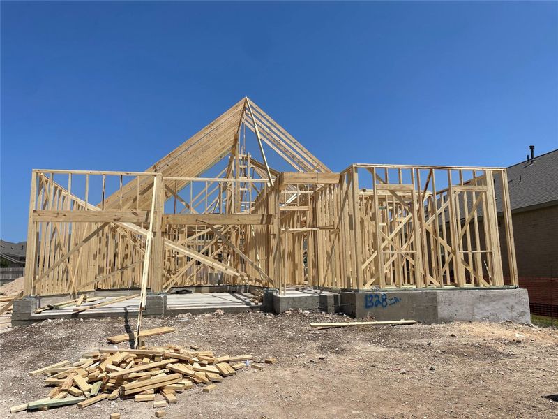 Front exterior of a new home in Berry Creek Highlands, Georgetown, TX, highlighting curb appeal (Image 13).