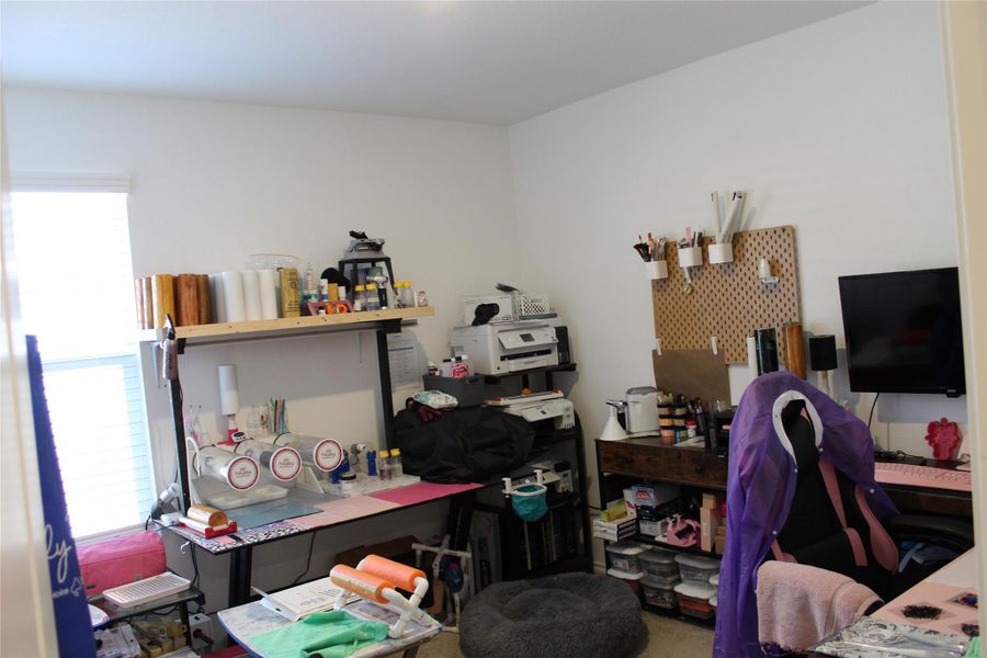 This bedroom is being used as the craft room, so it has plenty of space for home office or extra spacious room.