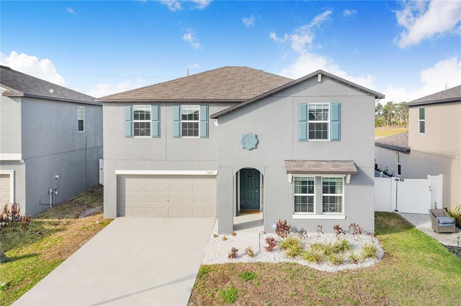 Front exterior of a new home in Wind Meadows South, Bartow, FL, highlighting curb appeal (Image 26).