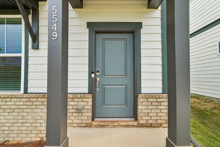 Exterior details and patio area of a home in Terraces at the Exchange, Indian Land (Image 25).