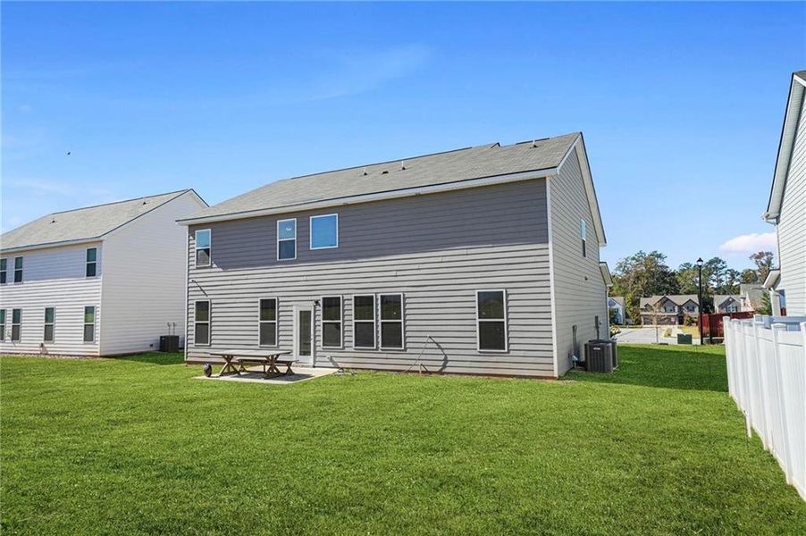 Exterior details and patio area of a home in Berkeley Lakes, Locust Grove (Image 28).