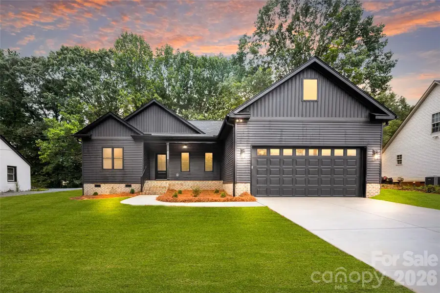 Front exterior of a new home in , Concord, NC, highlighting curb appeal (Image 1). Front exterior of a new home in , Concord, NC, highlighting curb appeal (Image 1).