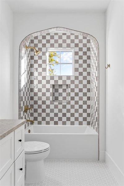 Bathroom featuring tub / shower combination, vanity, and tile patterned flooring Bathroom featuring tub / shower combination, vanity, and tile patterned flooring